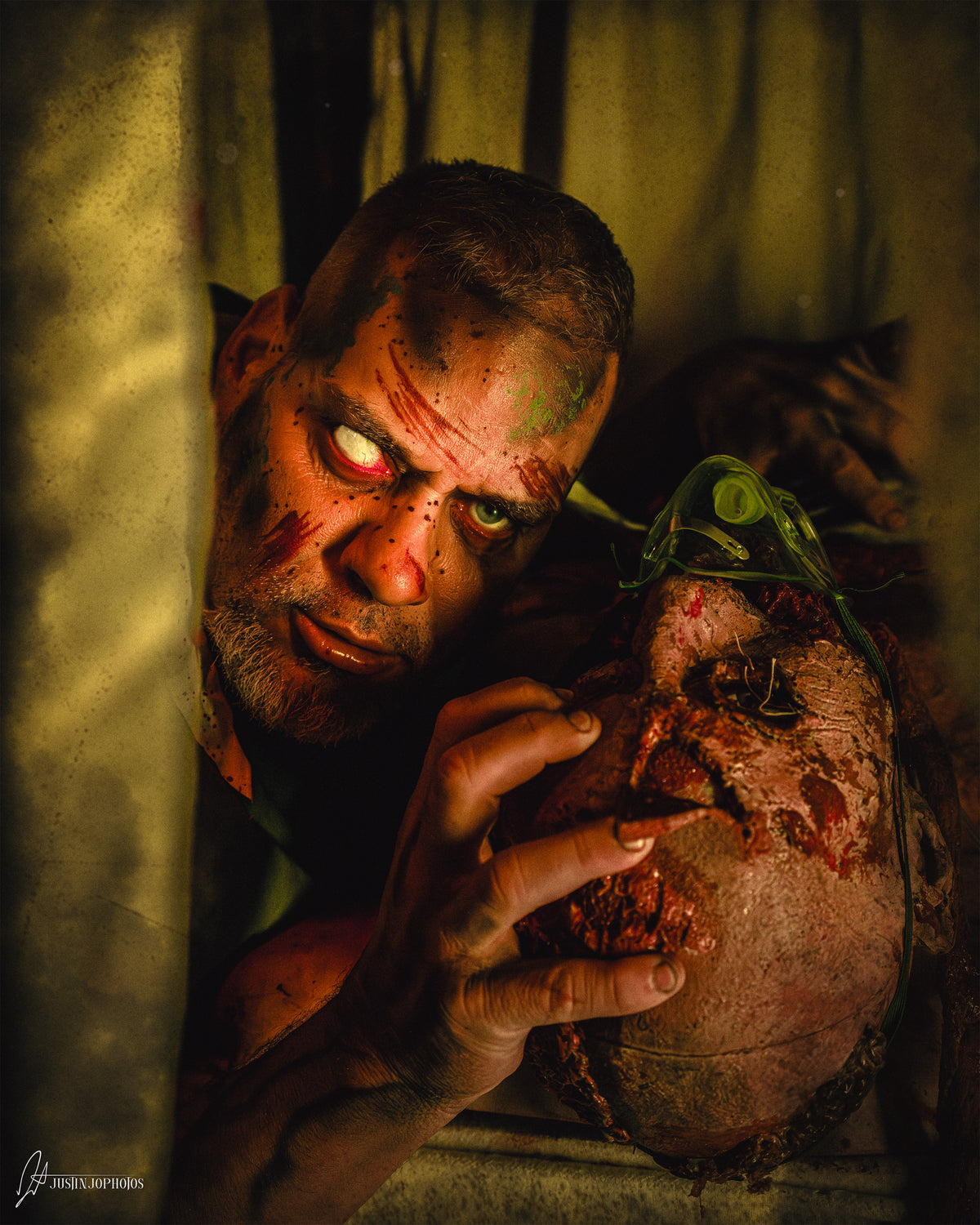 Bloodied figure lit in deep red