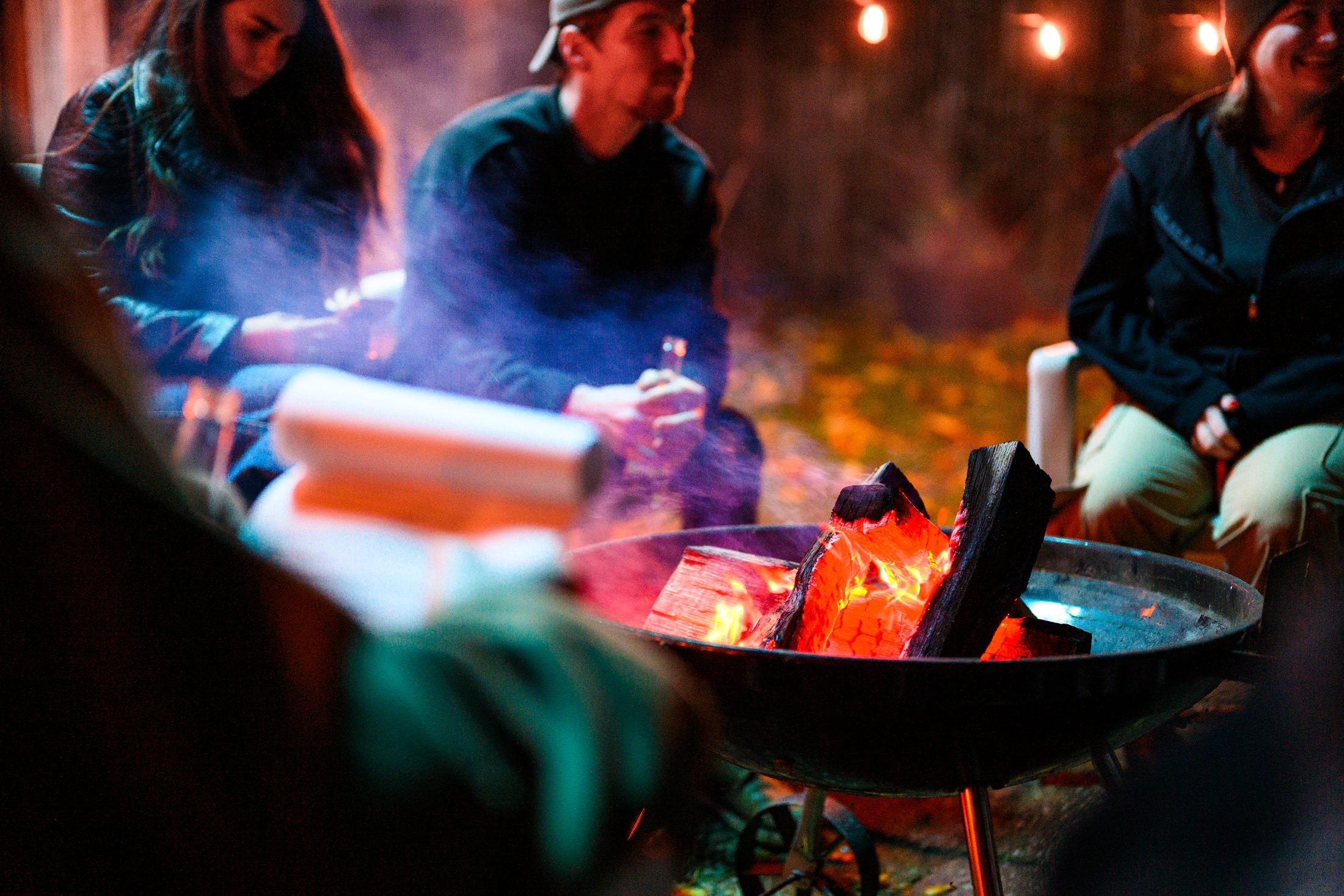 Fire pit burning on the night shoot, colour left in against black and white